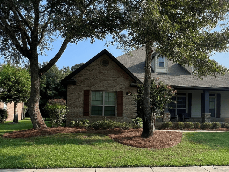 Mulch and Pinestraw in front of brick home